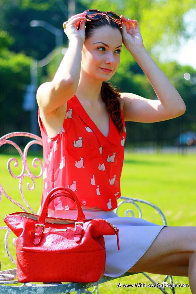 Marta Tryshak wearing Zara Cat Print Blouse, Club Monaco Zowie Skirt, Miu Miu Zebra Suede Flats, Kate Spade Little Blaine Satchel, YSL Arty Ring, Kate Spade Retro Sunglasses
